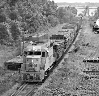 Led by new GP30 locomotive no. 1033, eastbound Louisville and Nashville Railroad local freight train approaches Ocean Springs, Mississippi, after crossing Biloxi Bay bridge in August 1963. Photograph by J. Parker Lamb, © 2016, Center for Railroad Photography and Art. Lamb-01-138-04