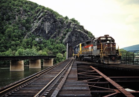 Eastbound CSX Transportation locomotives crossing the Potomac River in Harpers Ferry, West Virginia, on May 20, 1993. Photograph by John F. Bjorklund, © 2015, Center for Railroad Photography and Art. Bjorklund-44-29-03