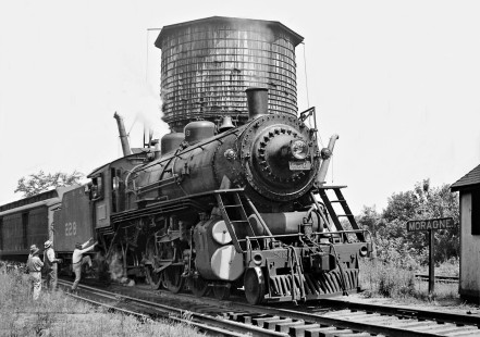 Eastbound Louisville and Nashville Railroad local passenger train no. 86 is ready to leave the water tank in Moragne, Alabama, near Attalla on its daily round trip between Birmingham and Calera in August 1951. (Note that tank has two spouts, serving both L&N and NC&StL railroads.) Photograph by J. Parker Lamb, © 2016, Center for Railroad Photography and Art. Lamb-01-136-06