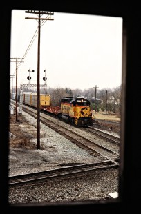 Northbound CSX Transportation freight train framed by the window of the signal tower in Leipsic, Ohio, on March 10, 1990. Photograph by John F. Bjorklund, © 2015, Center for Railroad Photography and Art. Bjorklund-44-08-07