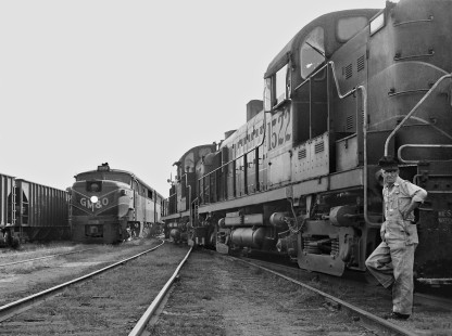 PA1 locomotive no. 290 leads Mobile-bound Gulf, Mobile and Ohio Railroad <i>Gulf Coast Rebel</i> through the yard south of the station in Meridian, Mississippi, as units for a northbound local freight train wait for clearance to couple to their cars in August 1956. Photograph by J. Parker Lamb, © 2016, Center for Railroad Photography and Art. Lamb-01-134-07