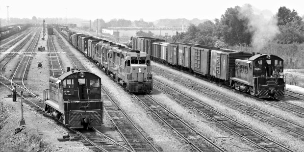 Action at Louisville and Nashville Railroad's Radnor Yard in Nashville, Tennessee, with departing northbound freight train passing between a pair of switchers in August 1963. Photograph by J. Parker Lamb, © 2016, Center for Railroad Photography and Art. Lamb-01-141-11