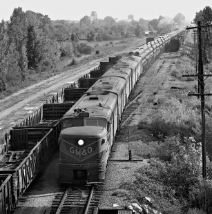 Southbound Gulf, Mobile and Ohio Railroad freight train departs yard in Meridian, Mississippi, with pipe headed to docks in Mobile, Alabama, in August 1958. Photograph by J. Parker Lamb, © 2016, Center for Railroad Photography and Art. Lamb-01-127-05