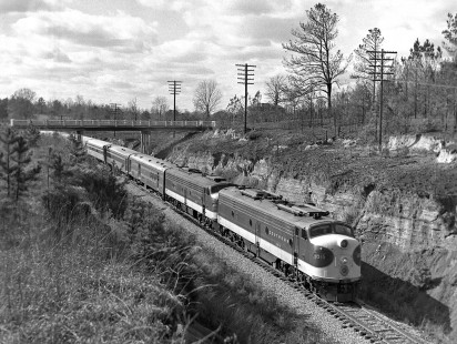 Year-end holidays always produced high levels of New Orleans visitors, requiring the Southern Railway <i>Southerner</i> passenger train to add cars and another locomotive. This view of northbound no. 48 was recorded near Enterprise, Mississippi (south of Meridian), in December 1954. Photograph by J. Parker Lamb, © 2016, Center for Railroad Photography and Art. Lamb-01-108-01