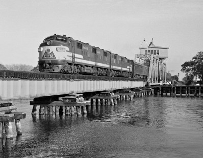 New Orleans-bound Louisville and Nashville Railroad <i>Humming Bird</i> passenger train crosses swing bridge at Pascagoula, Mississippi, in May 1955. Photograph by J. Parker Lamb, © 2016, Center for Railroad Photography and Art. Lamb-01-139-02