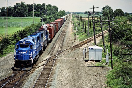 Westbound Conrail freight train crossing Norfolk Southern's former Wabash line (which is now a bike trail) near Wauseon, Ohio, on June 28, 1986. Photograph by John F. Bjorklund, © 2015, Center for Railroad Photography and Art. Bjorklund-30-06-16