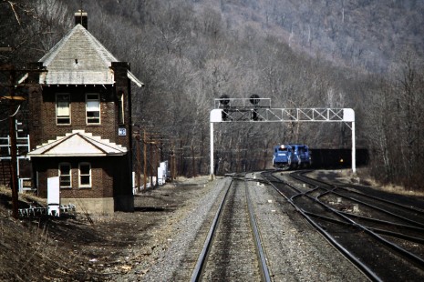 Helper locomotives on the rear of a westbound Conrail freight train passing MG Tower near Altoona, Pennsylvania, on March 23, 1988. Photograph by John F. Bjorklund, © 2015, Center for Railroad Photography and Art. Bjorklund-30-20-01