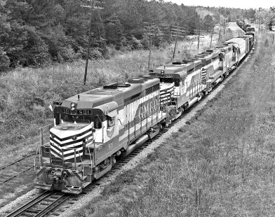 Gulf, Mobile and Ohio Railroad freight train Extra 501 South coils through S-curve south of Scooba, Mississippi (north of Meridian), in April 1965. Photograph by J. Parker Lamb, © 2016, Center for Railroad Photography and Art. Lamb-01-128-02