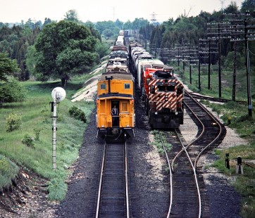 Eastbound and westbound Canadian Pacific Railway freight trains meet at Puslinch, Ontario, on May 27, 1979. Photograph by John F. Bjorklund, © 2015, Center for Railroad Photography and Art. Bjorklund-37-09-14
