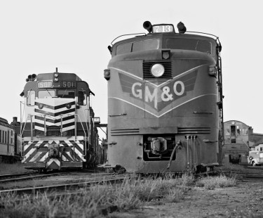 Old and new power on the Gulf, Mobile and Ohio Railroad ready tracks at Meridian, Mississippi, in July 1963. Pioneering FA locomotives (right) are giving way to supercharged EMD GP30s. However, pre-WWII Alco switcher (far right) continued its long career. Photograph by J. Parker Lamb, © 2016, Center for Railroad Photography and Art. Lamb-01-124-11