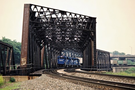Eastbound Conrail freight train crossing the Tuscarawas River bridge in Massillon, Ohio, on May 30, 1987. Photograph by John F. Bjorklund, © 2015, Center for Railroad Photography and Art. Bjorklund-30-15-15