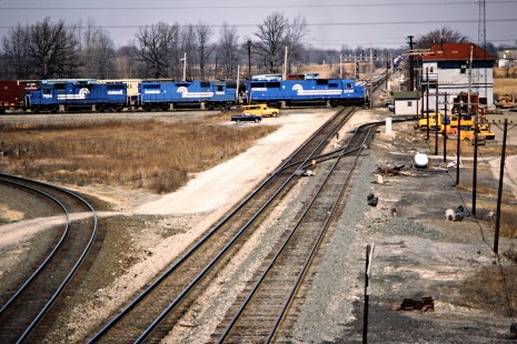 Eastbound Conrail freight train at crossing Conrail's former Toledo and Ohio Central line in Ridgeway, Ohio, on March 21, 1987. Photograph by John F. Bjorklund, © 2015, Center for Railroad Photography and Art. Bjorklund-30-11-16
