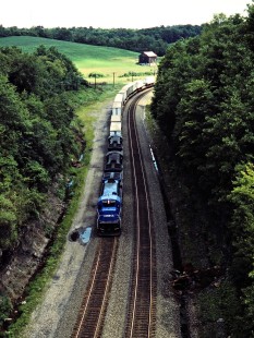 Eastbound Conrail freight train in New Galilee, Pennsylvania, on August 3, 1985. Photograph by John F. Bjorklund, © 2015, Center for Railroad Photography and Art. Bjorklund-29-21-04