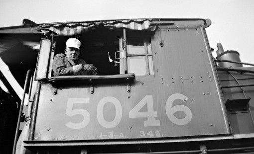Grand Trunk Western Railroad worker in cab of steam locomotive no. 5046 at Richmond, Michigan, circa 1940. Photograph by Robert Hadley; Hadley-04-107-02.JPG; © 2016, Center for Railroad Photography and Art