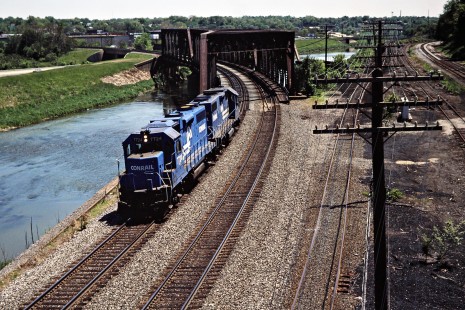Westbound Contrail locomotives crossing the Tuscarawas River at Massillon, Ohio, on May 16, 1987. Photograph by John F. Bjorklund, © 2015, Center for Railroad Photography and Art. Bjorklund-30-14-09