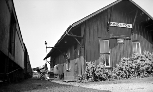 Grand Trunk Western Railroad train passes depot at Kingston, Michigan, circa 1955. Photograph by Robert Hadley; Hadley-05-012-02.JPG; © 2017, Center for Railroad Photography and Art