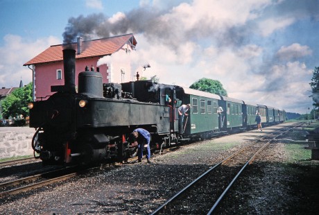 Workers and passengers inspect Waldviertler Narrow-Gauge Railway Club steam locomotive no. 298.207 during a station stop in Weitra, Lower Austria, Austria, on May 31, 1993. Photograph by Fred M. Springer, © 2014, Center for Railroad Photography and Art. Springer-Austria-17-36
