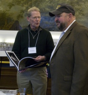 Dave Saums and Steve Barry discuss conference book at Saturday night reception. Center for Railroad Photography and Art. Photograph by Henry A. Koshollek