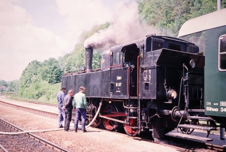 Three men inspect and water Association of Railway Friends (Verband der Eisenbahnfreunde) steam locomotive no. 91.107 in Kaumberg, Lower Austria, Austria, on May 19, 2001. Photograph by Fred M. Springer, © 2014, Center for Railroad Photography and Art. Springer-Austria-13-08