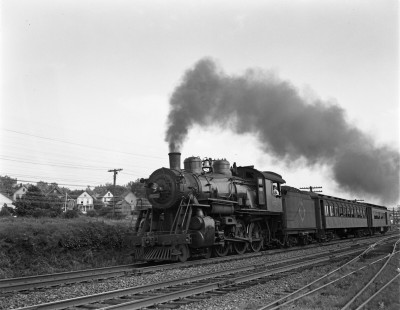 Erie Railroad 4-6-0 steam locomotive no. 972 with westbound passenger train on the main line of the NYS&W in Ridgefield Park, New Jersey, on June 27, 1941. Photograph by Donald W. Furler, © 2017, Center for Railroad Photography and Art, Furler-03-021-04