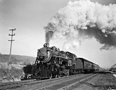 Delaware, Lackawanna and Western Railroad 4-6-0 steam locomotive no. 1016 leads passenger train west of Hackettstown, New Jersey, in January of 1941. Photograph by Donald Furler. Furler-03-013-04.JPG; © 2017, Center for Railroad Photography and Art