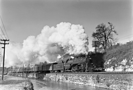 Reading Company 4-6-2 steam locomotive no. 215 pulling an eastbound passenger train along the Lehigh Coal & Navigation Company canal in Bethlehem, Pennsylvania, circa 1950. The old New Street bridge is visible in the background. Photograph by Donald W. Furler, © 2017, Center for Railroad Photography and Art, Furler-19-015-02