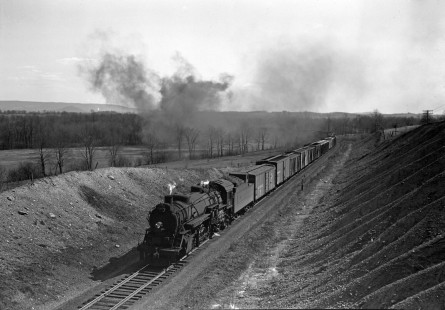 Lehigh and Hudson River Railway 2-8-2 steam locomotive no. 81 leads an eastbound freight train of 34 cars near Maybrook, New York on April 14, 1946. Photograph by Donald W. Furler. Furler-01-039-02, © 2017, Center for Railroad Photography and Art