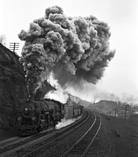Erie Railroad 2-8-4 no. 3322 pulling an eastbound freight train upgrade east of Port Jervis, New York, on November 21, 1940. Exhaust from pusher locomotive no. 4218 is visible in the distance. Photograph by Donald W. Furler, © 2017, Center for Railroad Photography and Art, Furler-03-049-03