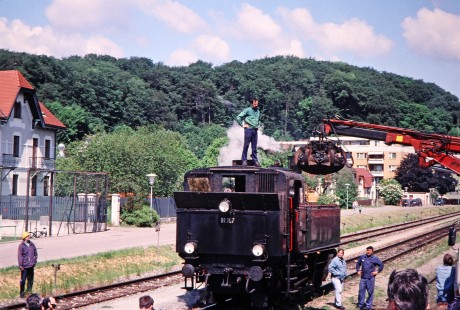A man supervises the loading of coal on to Association of Railway Friends (Verband der Eisenbahnfreunde) steam locomotive no. 91.107 as an interested crowd looks on in Pottenstein, Lower Austria, Austria, on May 19, 2001. Photograph by Fred M. Springer, © 2014, Center for Railroad Photography and Art. Springer-Austria-13-27