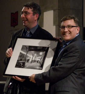 Otto Vondrak presents Ken Rehor, the winner of the Saturday print raffle with David Plowdin print. Center for Railroad Photography and Art. Photograph by Henry A. Koshollek.