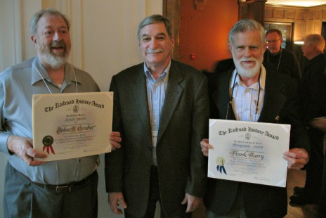 John Gruber, left, and Frank Barry, right, received awards from the Railway & Locomotive Historical Society at the conference, presented by Mark Entrop. Photo by Scott Lothes.